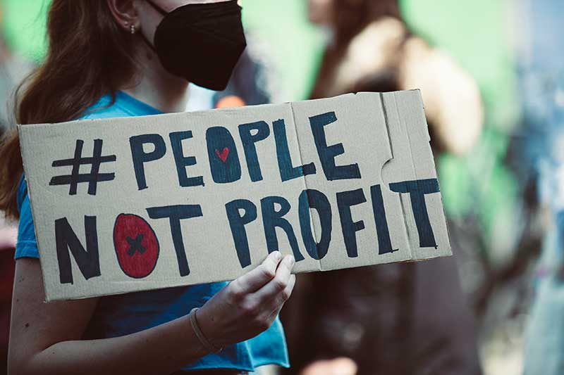 people-not-profit-protest-sign-colin-austin-gbiota
