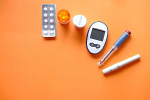 insulin-pen-diabetes-measurement-tools-orange-background-colin-austin-gbiota
