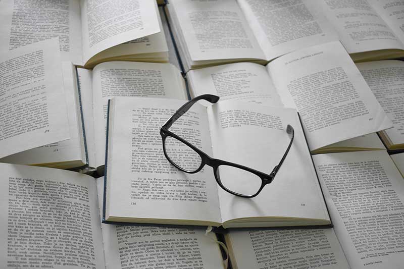 open-books-with-glasses-colin-austin-gbiota